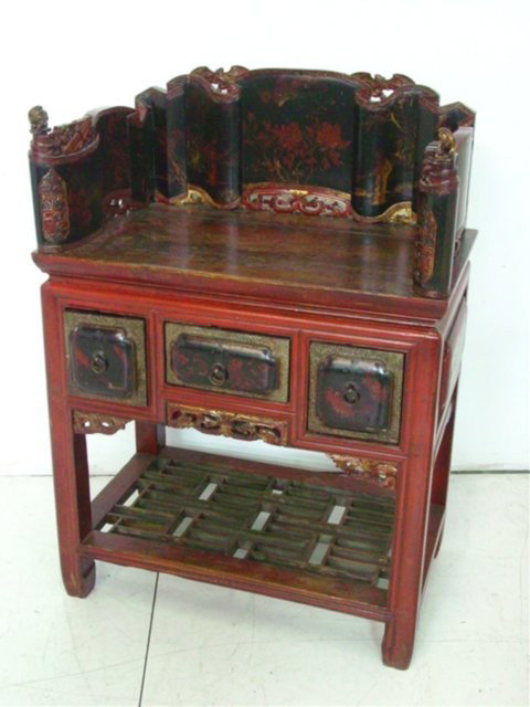 Buddhist red & black lacquer Altar chair: With exquisite red & gold painting depicting various scenes from Chinese life. Three drawers over fretwork shelf. Carved gold temple lions guard the seat. From Southern China. Makes a facinating & uni