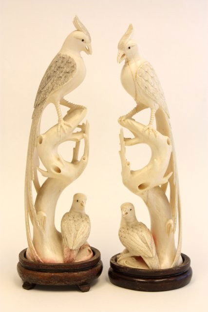 Pair Chinese carved ivory sculptures: Depicting "Birds in a Tree", mounted on wood base. Old repairs. Approx. 8.5" H with base. Please read our terms of sale.