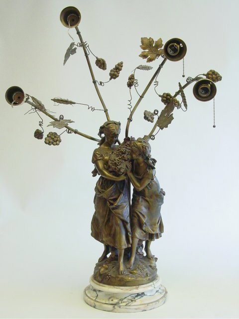 19th c. Gilt metal figural lamp on marble base: Attributed to Moreau, 4 light. Original plaque missing. Approx. 36" H. Please read our terms of sale.