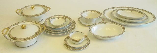 Theodore Haviland Limoges dinnerware set: Limoges, France. Consisting of; 9 cups; 12 saucers;12 luncheon plates, 1 chip; 2 covered tureens; 1 open tureen; gravy dish; 3 oval trays; 12 soup; 12 dinner plates; 12 fruit bowls; 12 salad plates; 1