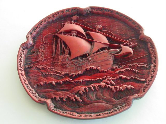 Chinese cinnabar plate artist stamp: Depicting "Sailing Ship at Sea", artist stamp en verso. Approx. 9.5" D. Please read our terms of sale.