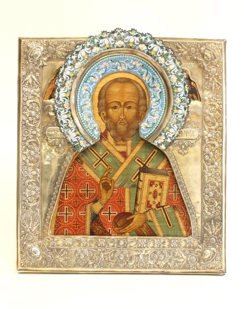 Russian icon with 19th c. silver & enamel Riza: Icon of St. Nicholas. Approx. 12.75" x 11". Please read our terms of sale.