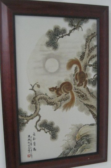 Framed porcelain plaque "Squirrels in Tree": Approx. 21.5" x 12.5". Please read our terms of sale.