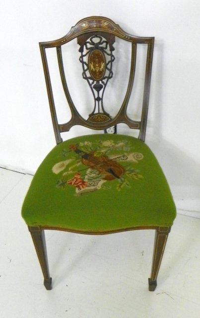 19th c. Inlaid slipper chair: Rosewood, ivory & satinwood inlays depicting cherubs, griffons, & musical instruments, needle point seat. Seat approx. 18.5" W x 35.5" H to back. Please read our terms of sale.