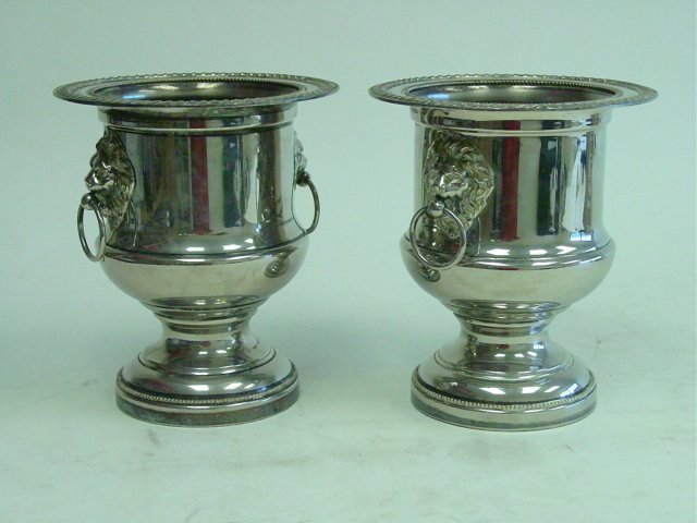 Pair English silver plate wine coolers: With "Lion" handles. Approx. 10" H. Please read our terms of sale.