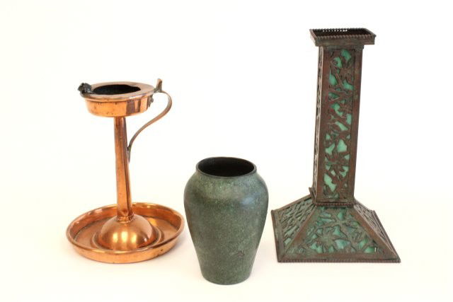 Lot of Arts & Crafts smalls: 1- Apollo Studios candlestick, approx. 8.25" . 1- Copper candlestick, approx. 6.25". 1- Heinz sterling on bronze vase with "Dragon Flies", approx. 4". 3 pieces in total. Please read our terms of sale.