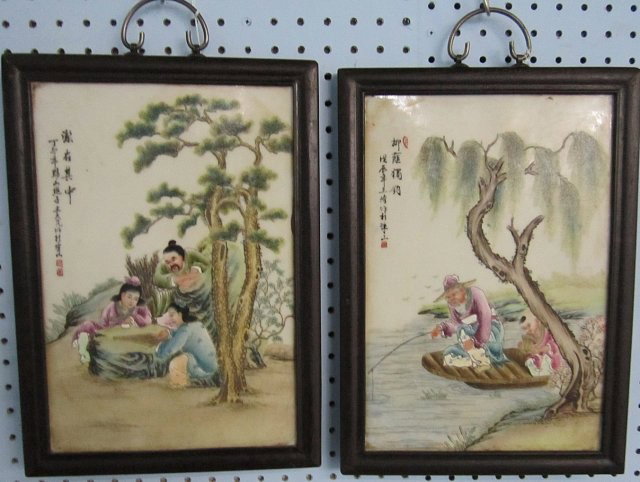 Pair of framed porcelain paintings: 1- "Man Fishing" 1- "People Playing a Game". Both approx. 14" x 9.5". Please read our terms of sale.