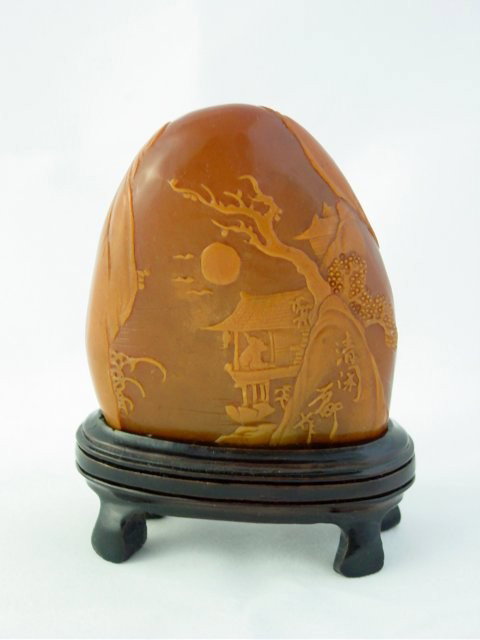 Carved stone by Tan Wang: "House Under Tree with Moon" on stand. Approx. 3" x 2.5". Please read our terms of sale.