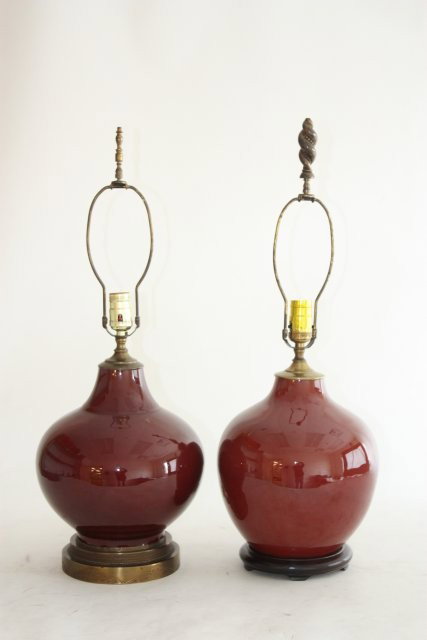 2 Sang de Boeuf Chinese vases: Mounted as lamps. Approx. 27" H to top of finial. Please read our terms of sale.