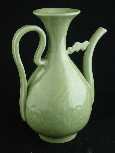 Celadon ewer with etched design: Long Quan ware, line on handle. Approx. 11.5" H. Please read our terms of sale.