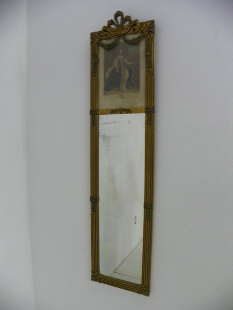 Trumeau mirror with lithograph: Lithograph depicting "Marie Antoinette", gilt painted with "Fleur de lis" cartouche. Approx. 13" W x 53" H. Please read our terms of sale.