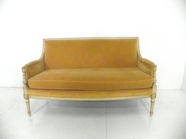 Louis XVI style off white painted settee: With gold upholstery, 1 cushion approx. 54" across x 34.5" H back. Please read our terms of sale.