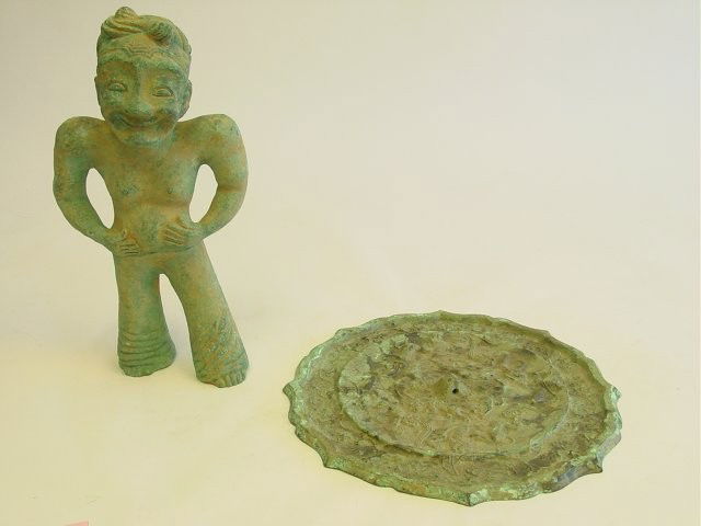 Group lot of 2 bronze pieces: 1- Bronze sculpture of "Farmer", approx. 13.75" H. 1- Bronze piece used as a mirror, approx. 12.25" Diam. Please read our terms of sale.