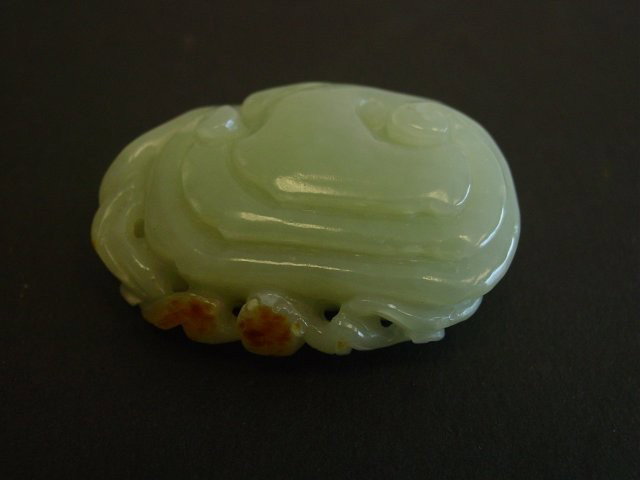 Celadon jade carving of "Ling Zhi": With russet on it. Approx. 2" L. Please read our terms of sale.
