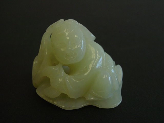 Light Celadon jade carving: "Man Carrying a Ling Zhi". Approx. 1.75". Please read our terms of sale.