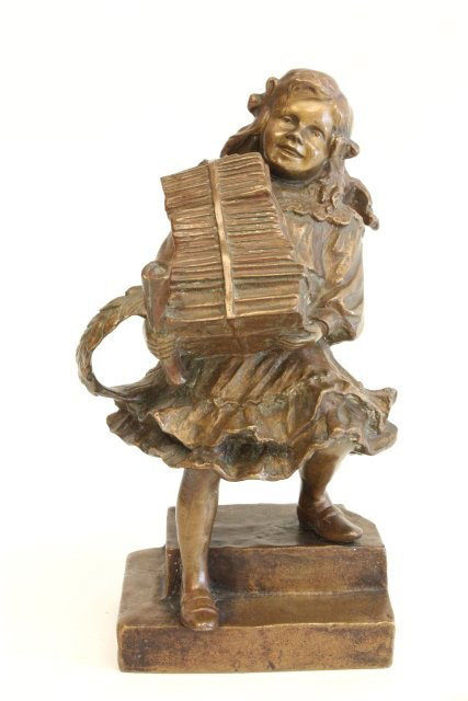 French bronze figure signed Leon Ovry: "Young Girl Carrying Books". Approx. 11" H. Please read our terms of sale.