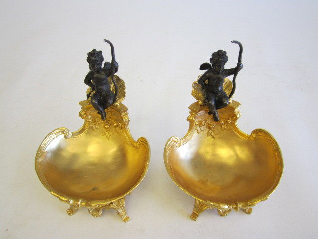 Pair clam shell & cherub dore bronze compotes: Approx. 9" H. Please read our terms of sale.