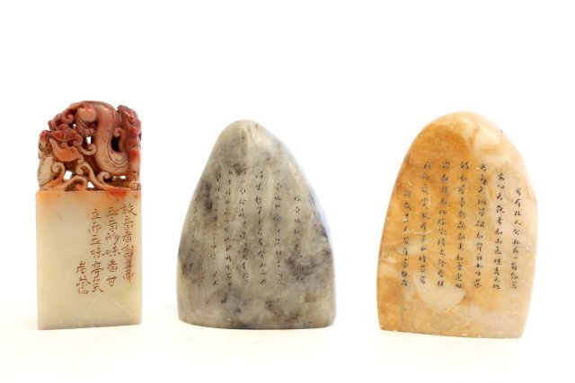 3 soapstone seals decorated with Chinese symbols: 1 with carved "Animal" on top. Approx. 3" H. Please read our terms of sale.