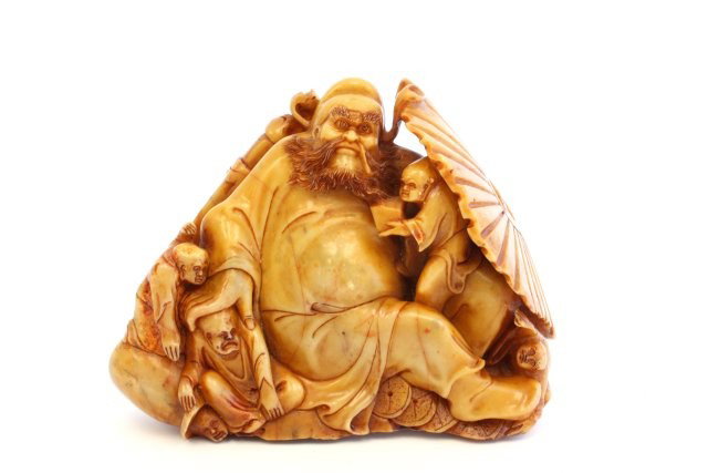 Soapstone sculpture: "Man with Children Holding a Fan". Approx. 6.5" x 4". Please read our terms of sale.