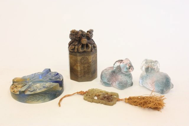 Group lot of assorted smalls: 1- Chinese soapstone seal with "Dragon", approx. 4". 1- Soapstone pendant, approx. 2.25". 1- Signed art glass pipe stand, approx. 3.75". 1- Pair signed glass rams, approx. 2.25" x 2.5". Please read ou
