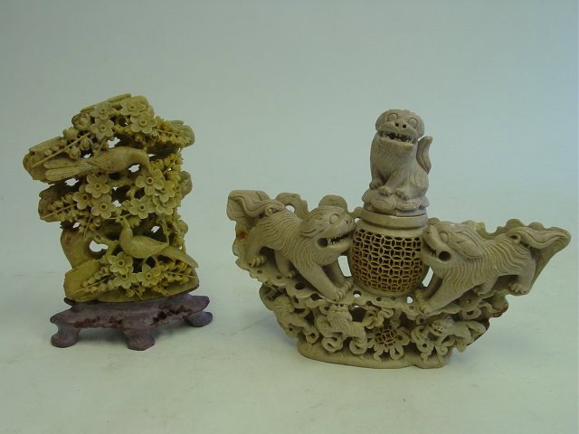 2 carved soapstone sculptures: 1- "Bird in Jade Tree", approx. 8.5" H. 1- Incense burner with 3 carved "Foo Dogs", approx. 11" W x 8.5" H. Please read our terms of sale.