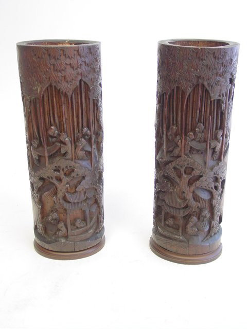 Pair bamboo carved cylindrical vases: Depicting "Village Life in the Jungle". Approx. 12" H. Please read our terms of sale.