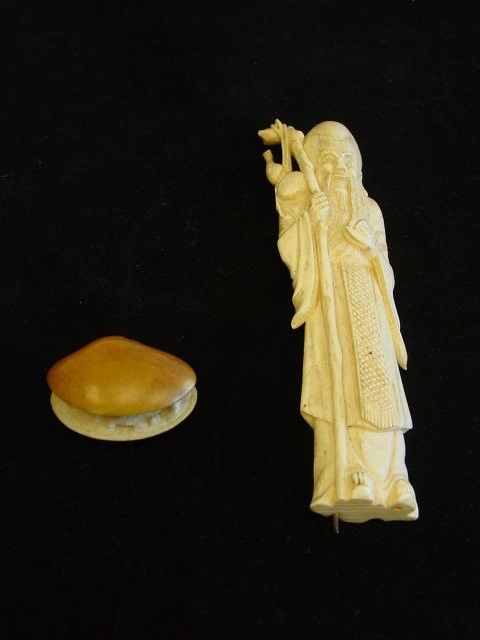 2 pieces ivory: Including: "Clam with Carvings" & "Old Man with Beard". Largest approx. 6" x 4". Please read our terms of sale.