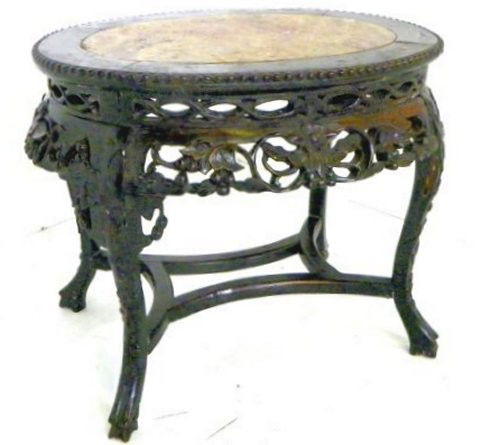 Oval Chinese marble top teakwood coffee table: Carved floral apron, ca. 1900's. Approx. 23.5" x 14.5" x 20". Please read our terms of sale.