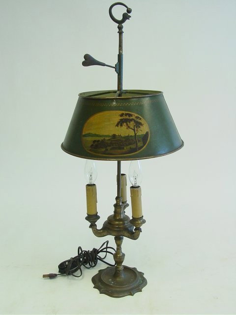 19th c. hand painted brass tole lamp: Converted to electric, 3 light, hand painted shade depicting "Landscape". Approx. 26.5" H, shade 11" Diam. Please read our terms of sale.