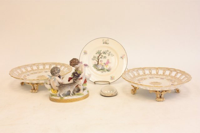 Group lot of antique porcelain: Including: pair Sevres reticulated compotes, Royal Worcester plate, European cupid grouping, paperweight. Please read our terms of sale.