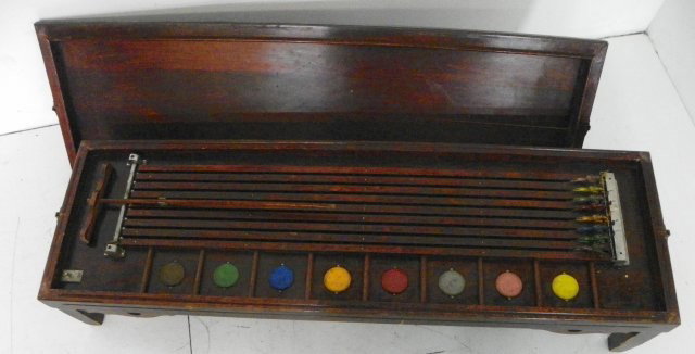 Horse racing game: Wolverine Supply & Manufacturing Co., Pittsburgh USA, has mahogany cover, horses are tin. Approx. 43" L x 13" across x 8" H. Please read our terms of sale.