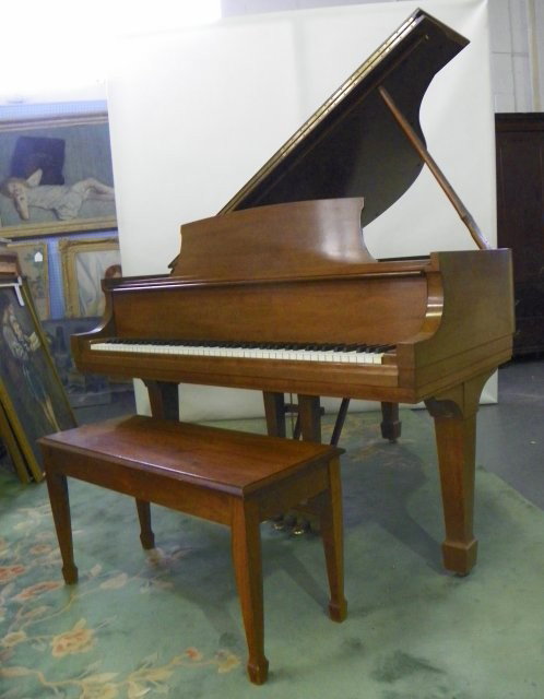 Steinway & Sons walnut baby grand piano & bench: #S 368650 , on tapered legs of square sections with spade feet. Approx 38.25" H x 60" L x 57" W. Please read our terms of sale.