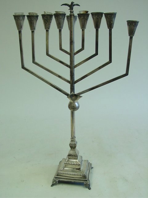 Sterling silver menorah with "Bird" on top: 1 arm has crack. Approx. 22.5" H x 14" across, 24 oz. Please read our terms of sale.