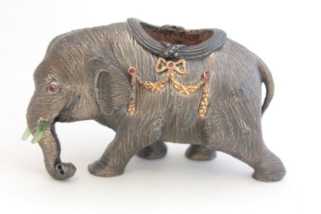 Russian silver & jeweled frencher salt: Ruby encrusted, Faberge stamps & jade tusks. Approx. 2" H x 3.25" W Please read our terms of sale.