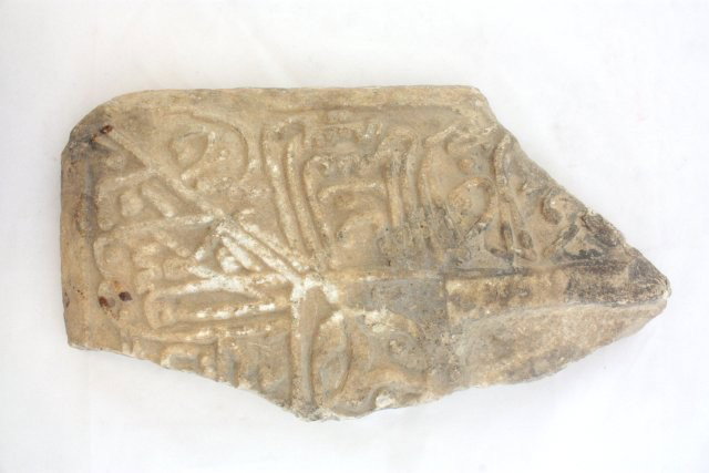 Fragment of Middle Eastern tombstone: With Islamic calligraphy. ca. 10th-12 th c.. Approx. 13.5" x 7.5" Please read our terms of sale.