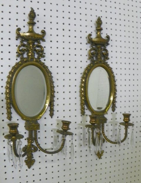 Pair Neoclassical brass mirrored wall sconces: 2 light, with 3 arms, not electrified. Approx. 24" x 8". Please read our terms of sale.