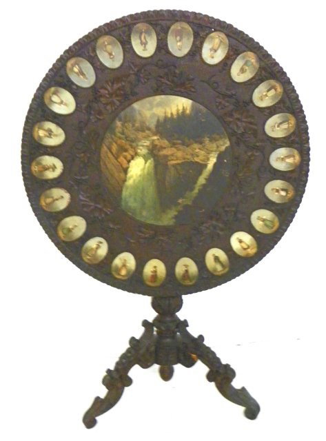 19th c. Black Forest carved tilt top table: Paper label Clementsenti Lake Interlocked. One leg as is. Please read our terms of sale.