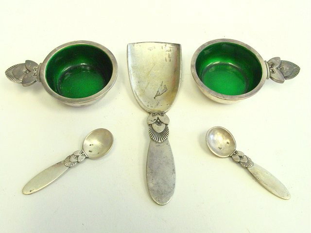 Pair sterling silver salt cellars George Jensen: Denmark, with spoons, green enameled interior & matching scooper. Approx. 4" L. Please read our terms of sale.