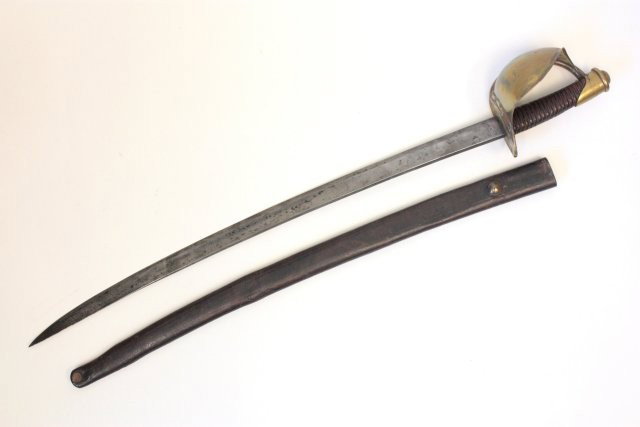 Ames Civil War cutlass with leather scabbard: Leather & brass hilt, blade 26", marked Ames Mfg Co., Chicopee, Mass., PGG, Anchor. Approx. 32" overall. From a Long Island estate collection. Please read our terms of sale.
