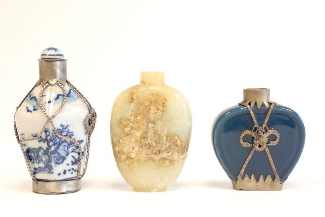 3 snuff bottles: Including: Blue & white, cobalt & stone bottles. Largest approx. 3.25" H. Please read our terms of sale.