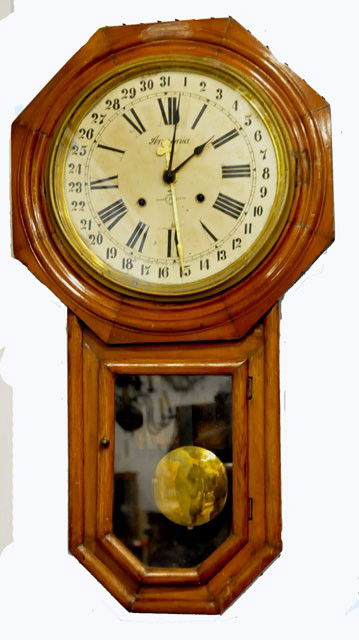 Ansonia octagon calendar wall regulator clock: Original finish shows normal age wear, time & strike movement, ca. 1900, original paper dial shows normal age wear, pendulum & key present, one hand replaced, being sold "as is". Approx. 31" H x 17" W