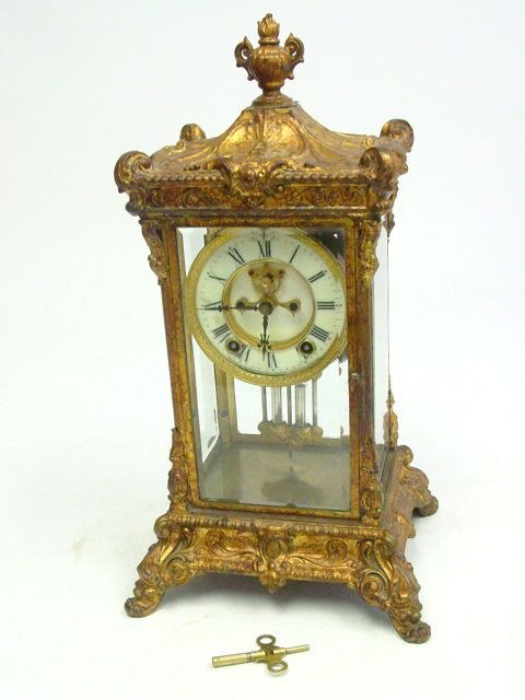 Old Ansonia crystal regulator clock: Gilt metal with beveled glassApprox. 18" H. Please read our terms of sale.