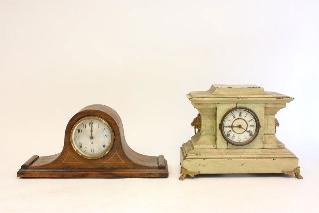 2 mantle clocks: Including: 1- Mahogany humpback Seth Thomas, approx. 9.5" x 20". 1- Off white wood case Sessions with brass claw feet, rack plate missing, approx. 12.5" x 16". Please read our terms of sale.