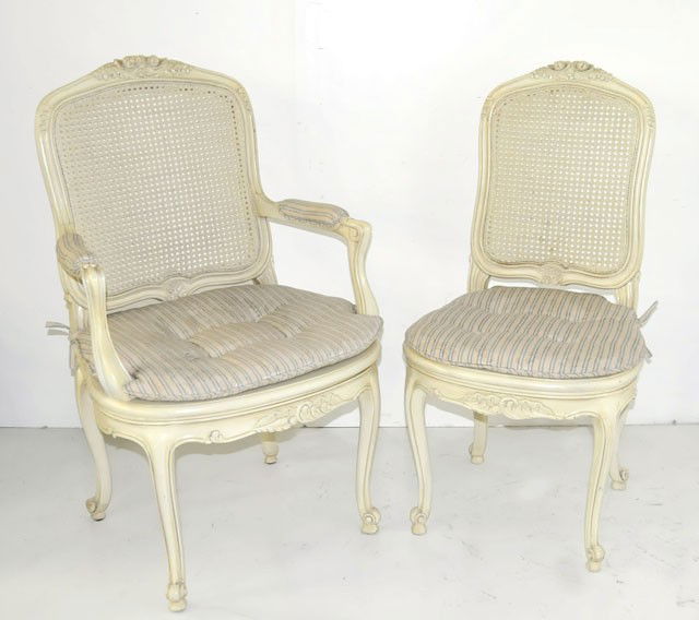 Set of 8 paint decorated cane back chairs: 2 arms, 6 sides. 2 bottoms with damage. Please read our terms of sale.