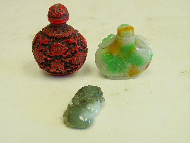 Group lot of 3 smalls: Including: Jade figurine, jade snuff bottle & cinnabar snuff bottle. Largest approx. 3" H, smallest 2" L. Please read our terms of sale.