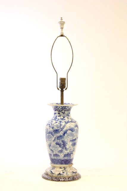 Chinese blue & white vase mounted as a lamp: On wooden, handpainted base. Vase approx. 12" H, 32.25" H with lighting structure. Please read our terms of sale.
