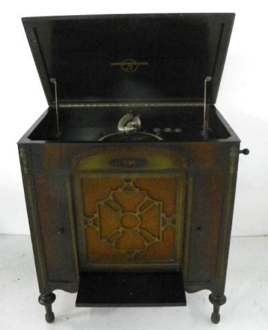 Columbia record player in mahogany cabinet: Floor model "710" 78RPM and has 200 records. Approx. 36"H X 33"W X 21"D.