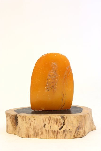 Carved soapstone on wood stand: Stone approx. 3" H x 2.25" W. Stand does not match stone.