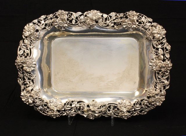 Oblong sterling silver bowl sold by Duhme & Co.: Made by Dominick & Haff, with "Floral" design, open reticulated border. Approx. 76 ozt, 17.75" L x 13.5" W x 3" H..