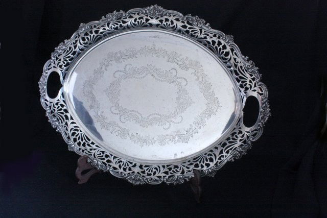 Sterling silver English Sheffield serving tray: Early 20th c., on ball feet, dated 1911, hallmarked on face front, with touch mark on ball feet, 2" open reticulated border, Robert F. Mosely. Approx. 25" x 19", 2736 grams, 87.5 ozt.